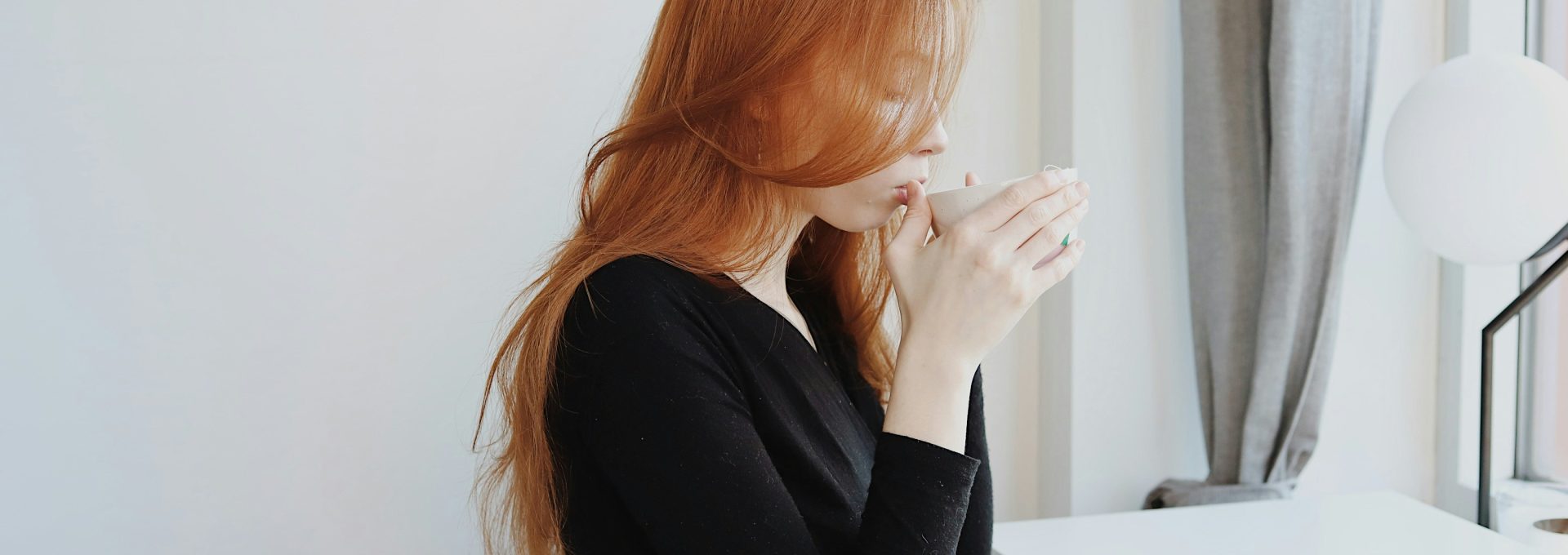 woman in black long sleeve shirt sitting on chair